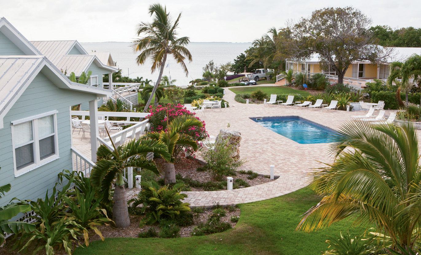 The pool and cottages at Firefly Sunset Resort