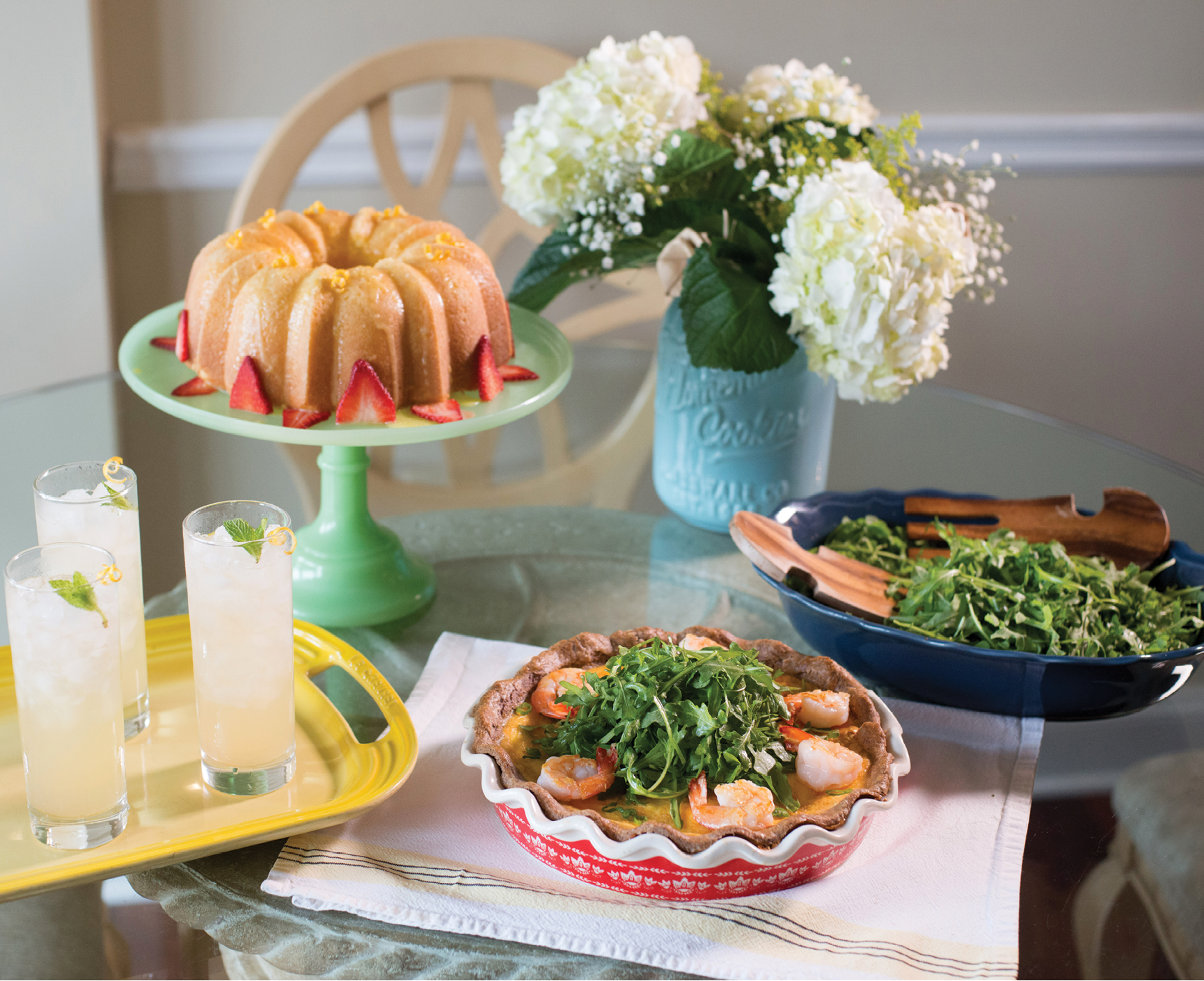 A relaxed lunch of quiche, lemon cake, and gin fizzes.