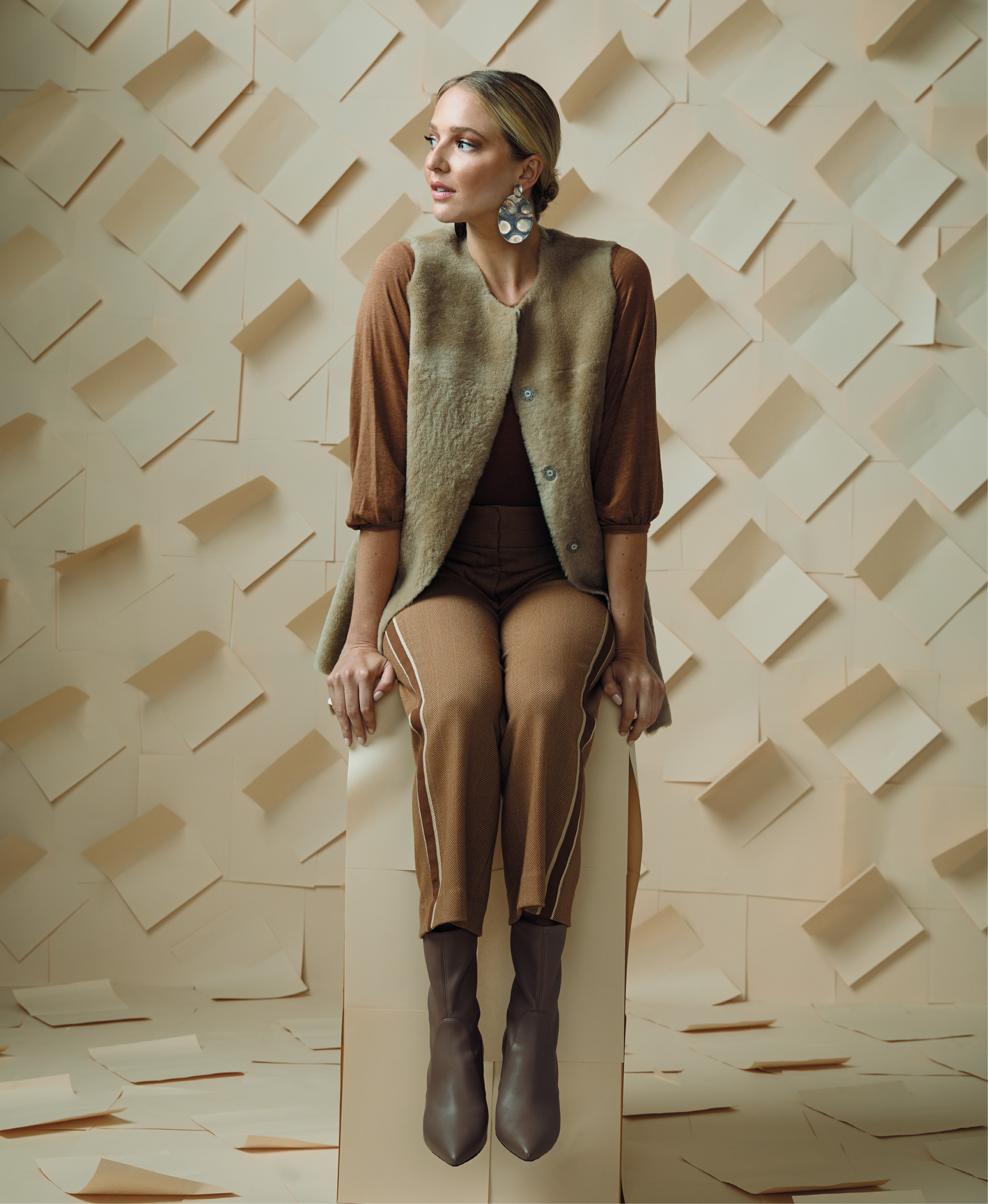 Khaki Club - Velvet by Graham &amp; Spencer “Camilla” cotton top, $128 at Copper Penny; Fabiana Filippi vest, $3,348 at fabianafilippi.com; Veronica Beard “Cormac” herringbone trousers with side stripes, $475 at Gwynn’s of Mount Pleasant; Sheila Fajl “Nicholas” earrings, $92 at Rhodes Boutique; Stuart Weitzman “Landry 75” nappa leather booties in “Adobe Beige,” $595 at Gwynn’s of Mount Pleasant