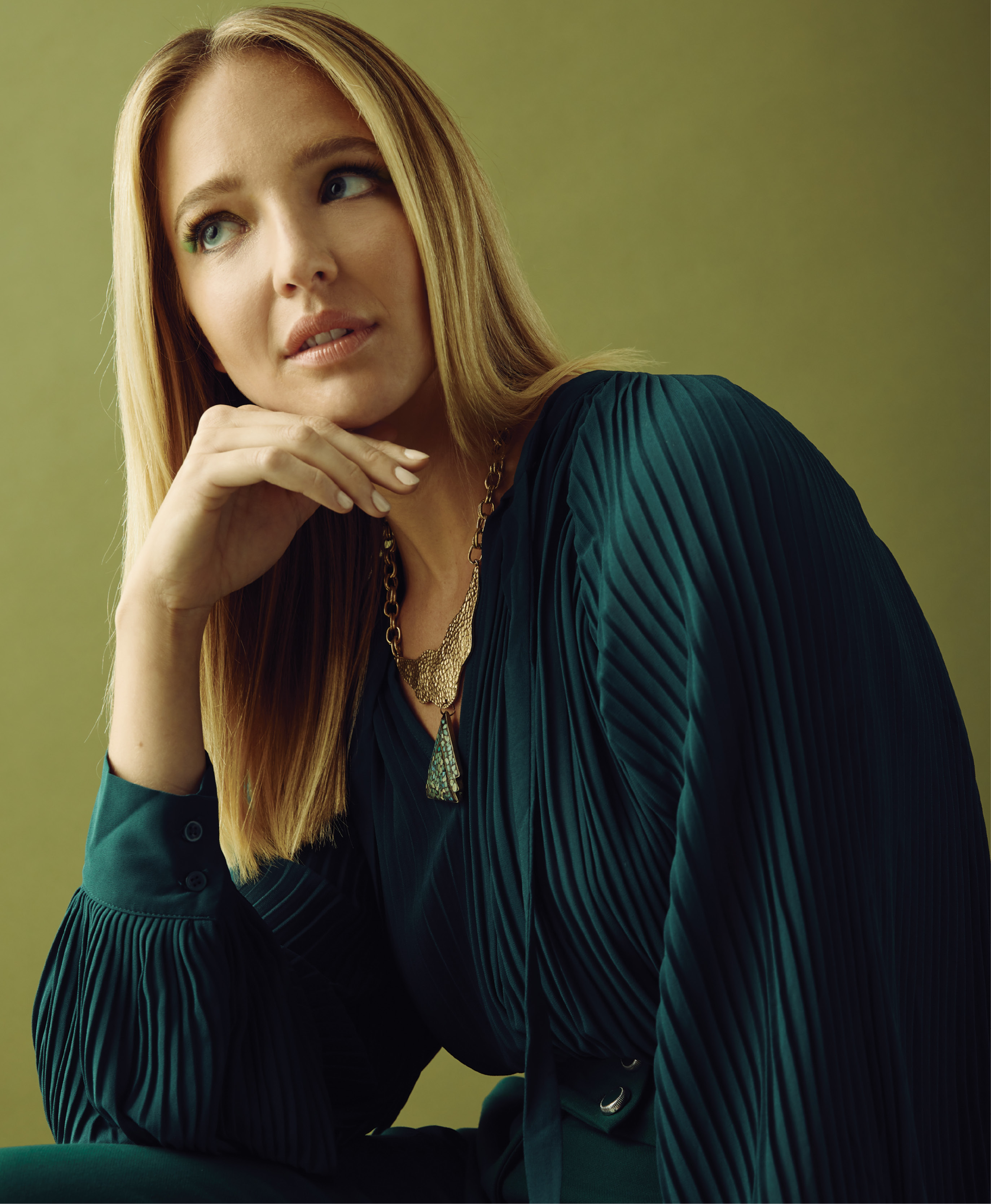 Emerald Isle - Endless Rose chiffon pleated top in “emerald,” $94 at Maris DeHart; Veronica Beard “Townsend” pants, $395 at Gwynn’s of Mount Pleasant; Made in The Deep South by Michela Bruno jade triangle collar necklace, $248 at Woodhouse Day Spa; Henry Beguelin leather bag with mink handle, $1,130 at RTW; Thelma suede penny loafers, $388 at Shoes on King