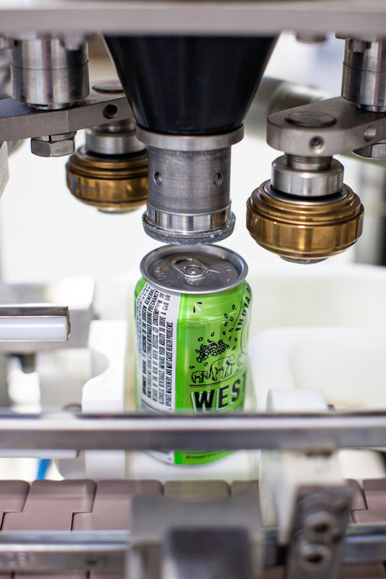 A can of IPA about to be seamed.