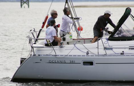 Catching A Breeze: (Top to bottom) Captain Eddie Evans and his crew aboard Naut on Call.