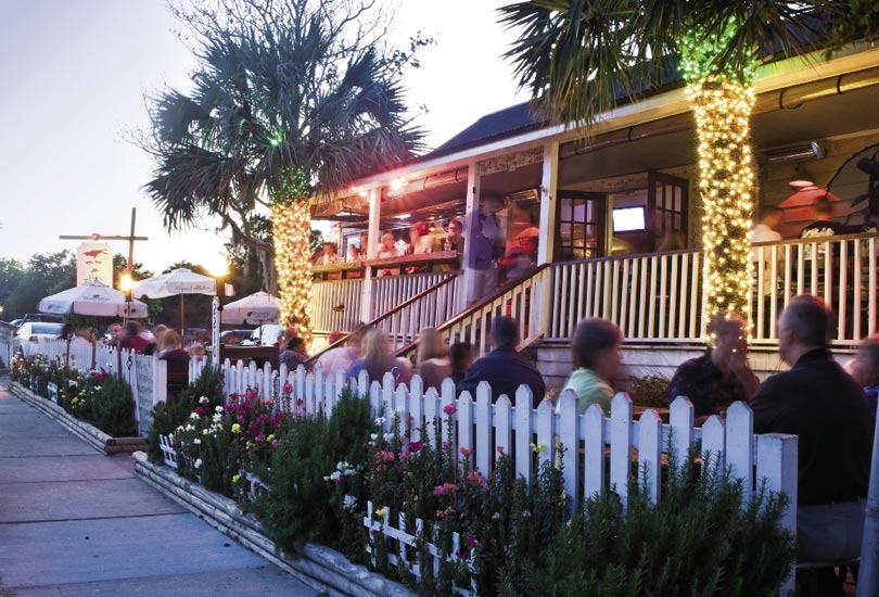 Grab a coveted seat on the Poe’s Tavern porch or patio for some of the best burgers and salads around.