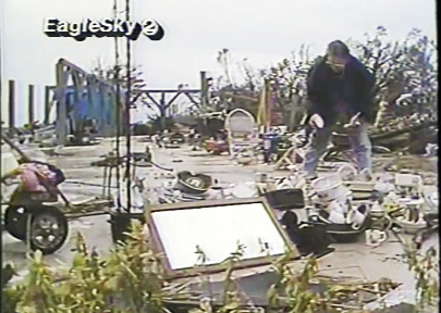 Just south of there near Awendaw, a woman attempted to gather what was left behind on her home’s foundation.