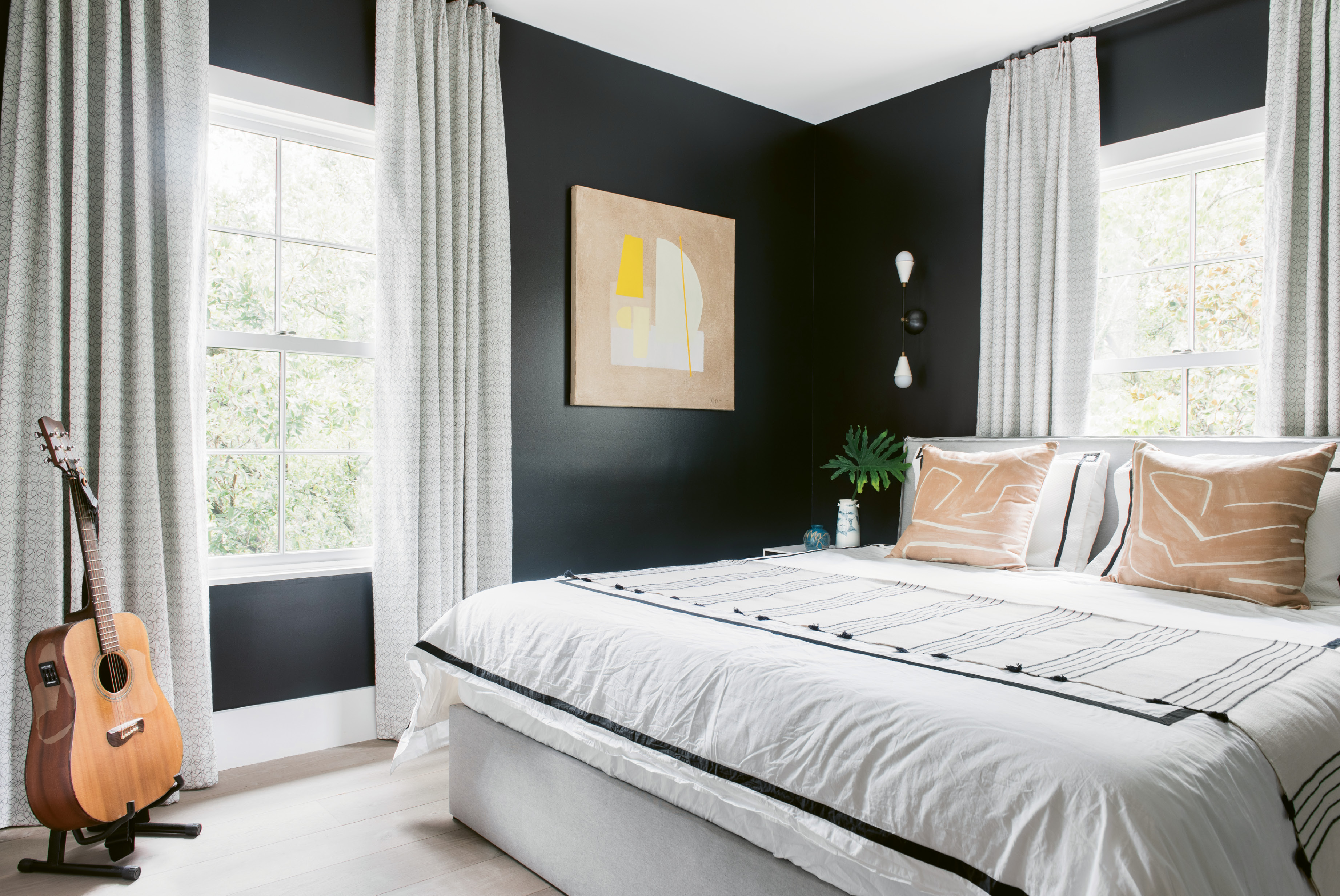 In the guest room, textiles—such as draperies by North Carolina-based Adelene and accent pillows by Kelly Wearstler—add subtle patterns and texture.