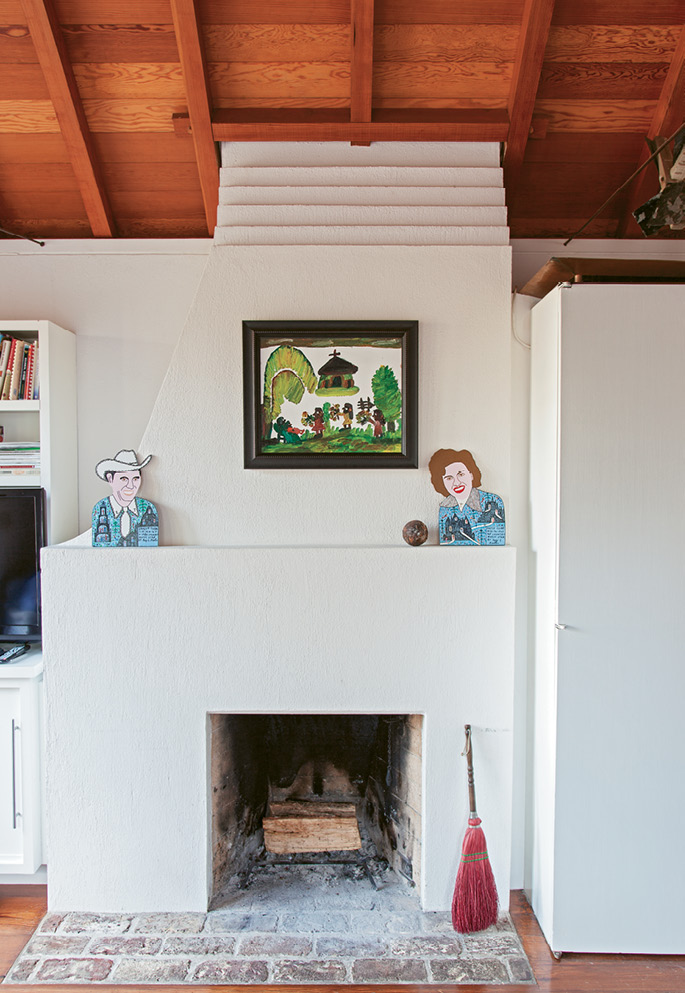 Two fireplaces cozy things up in the ship-like kitchen; the hearths are historic, but the clean-lined surrounds and mantels feel modern.