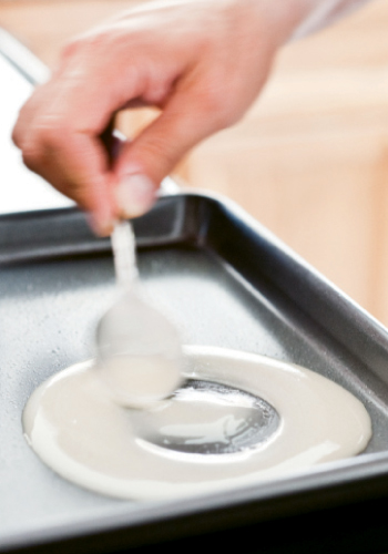 To form a fortune cookie: 1. Use back of a spoon to spread batter into four-inch rounds.