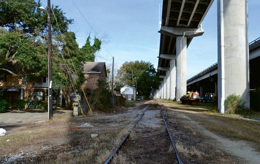 Unused Norfolk  Southern line now: Currently barren and blighted, the abandoned Norfolk Southern rail lines that run beneath I-26 through the heart of downtown will be reclaimed and turned into a multi-use linear park, connecting the Neck and the lower peninsula and adding much needed recreational and bike/pedestrian access through what is now no man’s land.