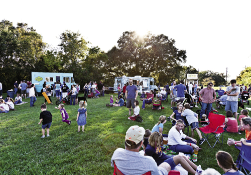 a crowd lingers at Holy City Brewing’s fall food truck rodeo in October.