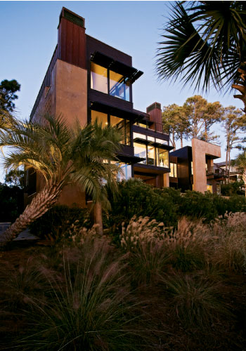 circa 1959. The serene master bedroom affords views of both marsh and sea (top).