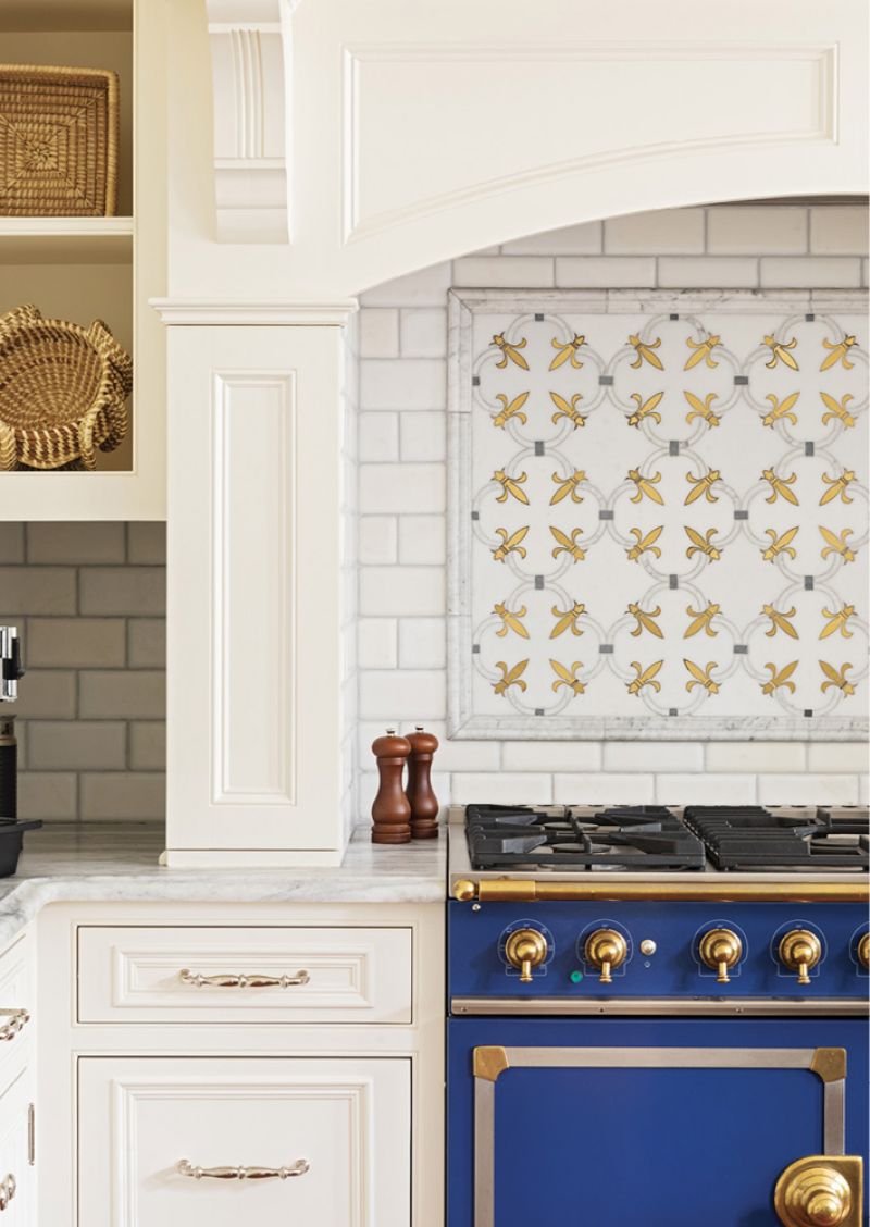 The metallic tones complement the bright blue La Cornue range.