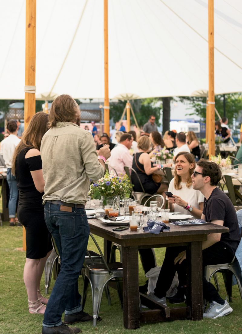Guests mixed and mingled at community tables.