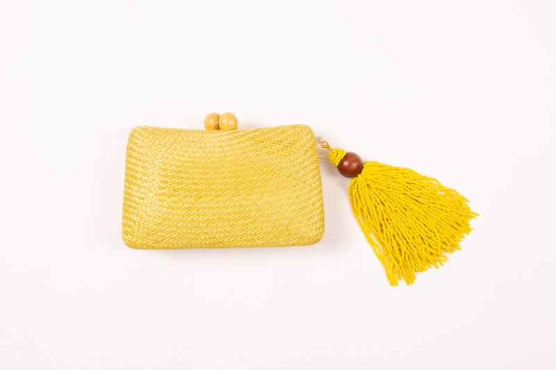 Serpui “Charlotte Bun” straw clutch, $238 at Berlin’s for Women