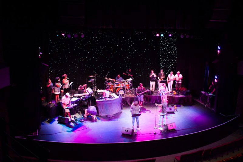 The musicians warm up on the Charleston Music Hall stage before the concert.