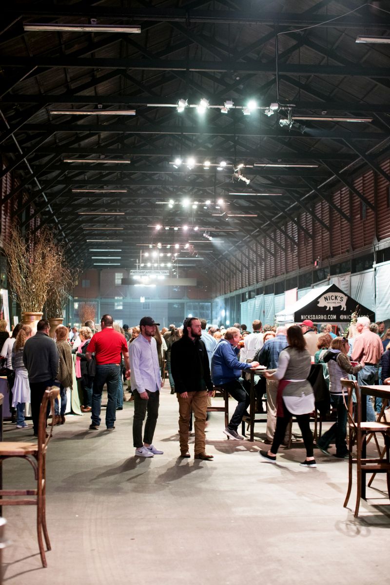 Guests mingling throughout the open-air party space