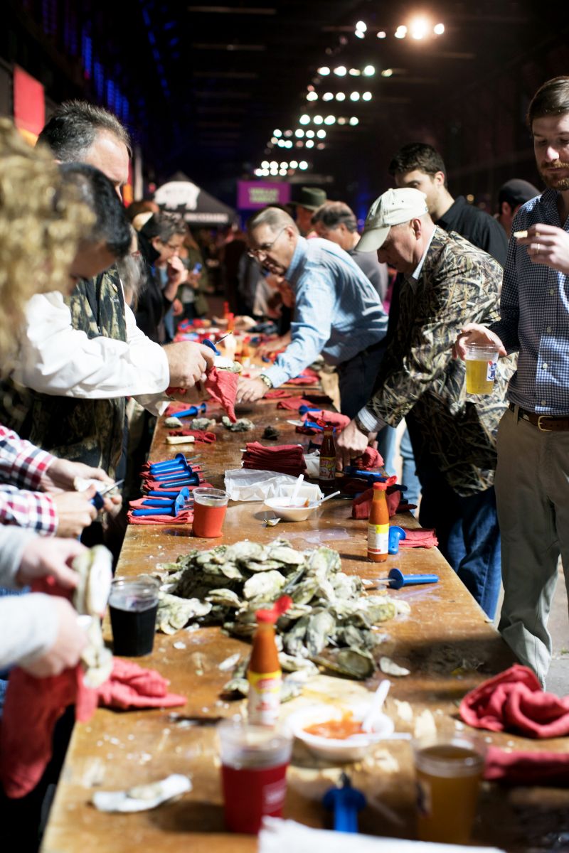Guests gathered around communal tables to dig into heaps of steamed oysters.