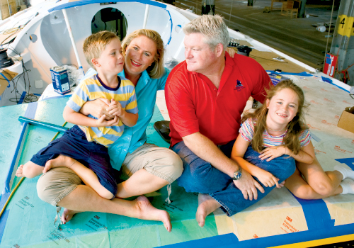 Wyatt, Meaghan, Brad, and Tate sit at the transom of Le Pengouin during pre-race preparations. The family is participating in a reality TV series about the race that will be hosted and produced by Phil Keoghan of CBS’s The Amazing Race. Photograph by Kaitlyn Iserman